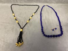 Cobalt/Bristol blue graduated circular bead necklace, and matchin ear studs, and a jet and amber