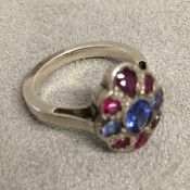 18ct white gold ruby & sapphire set flower ring in the manner of Sibyl Dunlop, 5.6g size N
