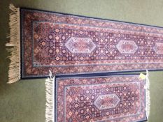 Rugs: Red ground runner with blue borders and geometric designs, and a similar smaller Runner 269