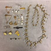 Collection of unmarked yellow and white metal dress items to include cufflink tie clips, together