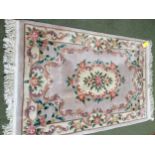 Chinese wash style rug with blue/green ground and all over floral design with central medalionrug