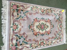 Chinese wash style rug with blue/green ground and all over floral design with central medalionrug