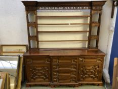 C17th style oak breakfront dresser, with geometric carved panel cupboard doors, together with oak