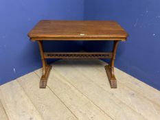 Light honey coloured oak table, with galleried central stretcher and ecclesiastical carvings to each