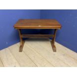 Light honey coloured oak table, with galleried central stretcher and ecclesiastical carvings to each