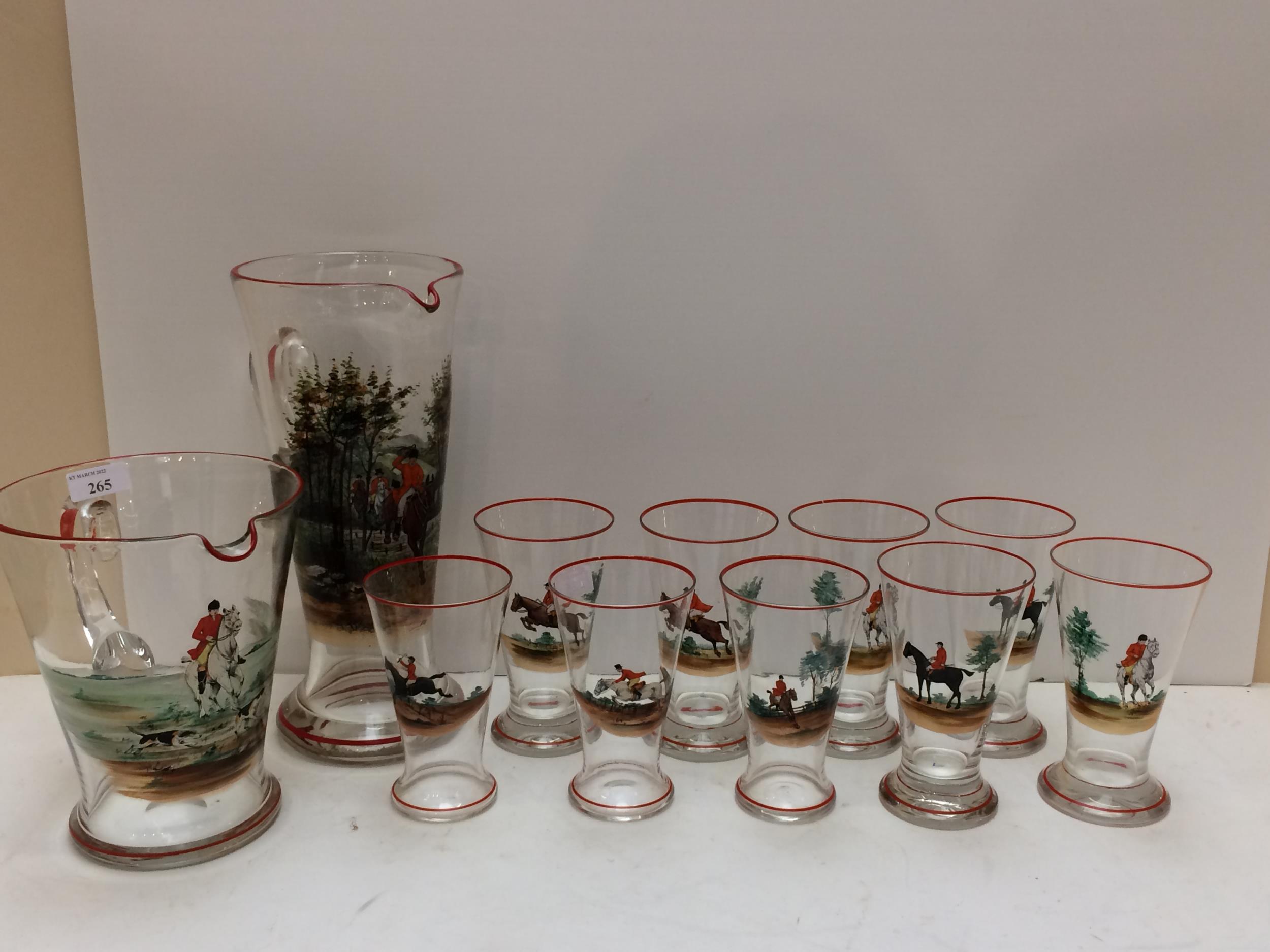 A vintage, decorative hunting themed glass set comprising a tall lemonade jug, a wide Pimm's jug and