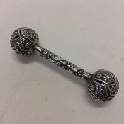 Indian white metal baby rattle with pierced decoration