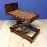 Edwardian mahogany metamorphic stool with bergère to top (some areas of caning in need of repair)