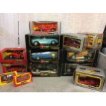 A collection of Burago die cast metal boxed toy cars of various scales to include a Mercedes Benz