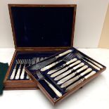 A good cased set of Sterling silver fish knives and forks and servers, with mother of pearl handles,