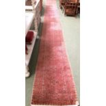 Rugs: A Long red ground runner 2 with all over geometric stylized patterns 72cm x 722cm