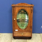 An oak and glazed hanging wall cabinet, with drawer, the glass inscribed "Parfumerie Eau de