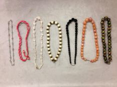 Collection of beaded jewellery to include a carnelian carved strand