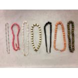 Collection of beaded jewellery to include a carnelian carved strand