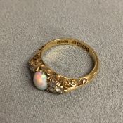 18ct gold opal and old cut diamond ring central oval cabochon opal with single cut diamond