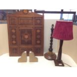 Two wooden table lamps, and a pair of stone bookends, purporting to come from The houses of