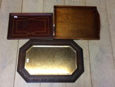A modern wall mirror, and 2 wooden trays