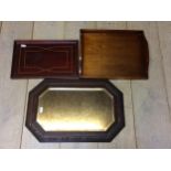 A modern wall mirror, and 2 wooden trays