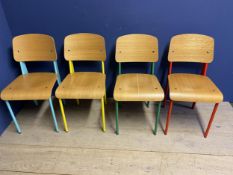 A set of 4 vintage style chairs with moulded ply seats and backs, and coloured