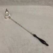 Cartier sterling silver candle snuffer with twist handle and turned wooden finial, in original