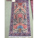 4 rugs, 3 red ground rugs with all over geometric stylized designs, and a blue and red ground Tree