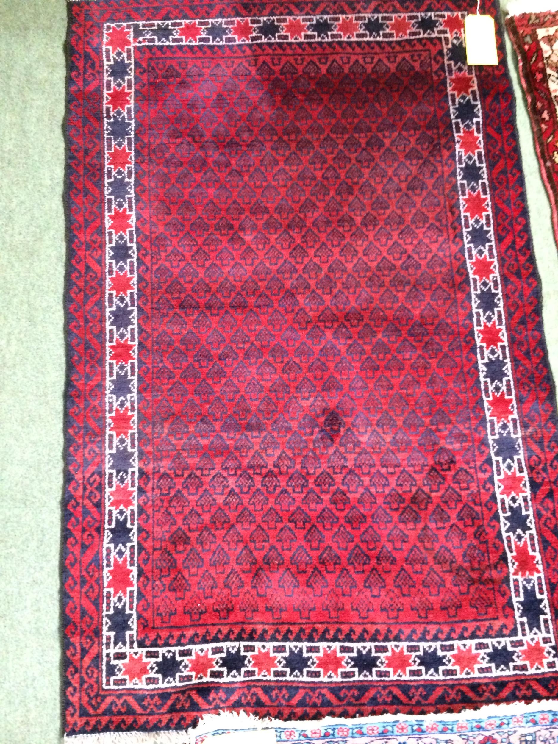 4 rugs, 3 red ground rugs with all over geometric stylized designs, and a blue and red ground Tree - Image 7 of 9