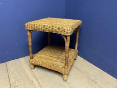 A wicker 2 tiered side table