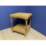 A wicker 2 tiered side table