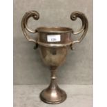Sterling silver trophy with scrolling handles on circular base, Birmingham 1936, 10.5ozt, 26cm H