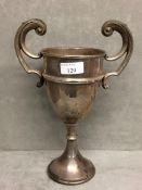 Sterling silver trophy with scrolling handles on circular base, Birmingham 1936, 10.5ozt, 26cm H
