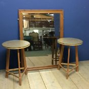 A modern pine wall mirror, and 2 chip board circular top tables