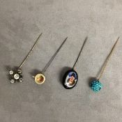 Collection of four hat pins, one with cabochon turquoise finial