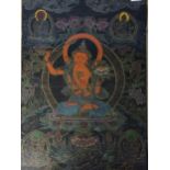 Thangka Manjusri depicted as a male bodhisattva weilding a flaming sword in his right and hand