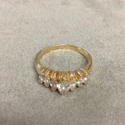 14k gold and diamond ring set with graduated line of marquis cut diamonds, 4.1g