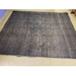 A good heavy pile black wovern rug, 298 x 241cm