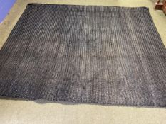 A good heavy pile black wovern rug, 298 x 241cm