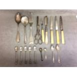 A collection of sterling silver and unmarked white metal items to include an Irish silver spoon, fox