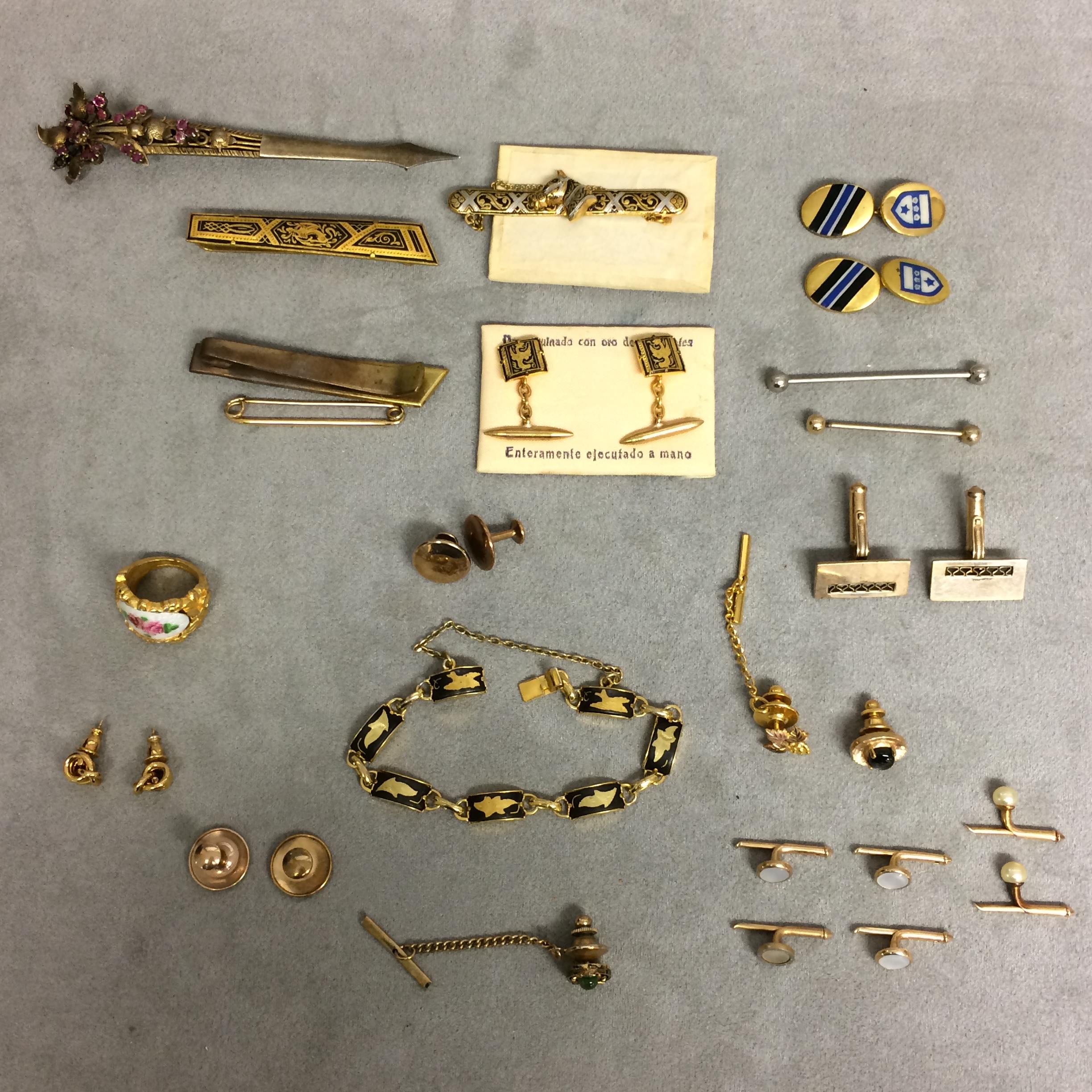 Collection of unmarked yellow and white metal dress items to include cufflinks, dress studs, and