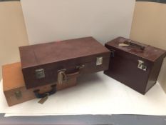 Three vintage cases, including a hat box, and one case by Olympic Corp