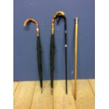 Sticks & canes: 2 black and bamboo handled umbrellas and 2 hallmarked silver walking canes