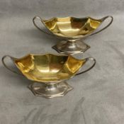 A pair of Georgian silver salts with loop handles and gilt interiors by Robert and Samuel Hennell,