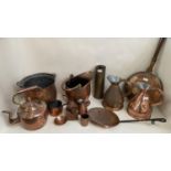 Quantity of brass and copper wares to include kettles, jugs, warming pans, and a Brass Shell