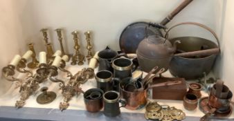 A quantity of brass and copper wares, to include light wall sconces, early candlesticks, jam pan,