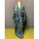A C20th Oriental silk robe, blue ground with flowers