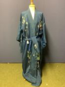 A C20th Oriental silk robe, blue ground with flowers