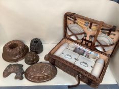 Quantity of Vintage copper jelly moulds, and a vintage wicker picnic set with fitted interior (