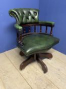 A good green leather and button backed swivel chair, some minor wear and marks to leather