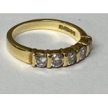 An 18ct gold five stone diamond ring size I, 3.33g