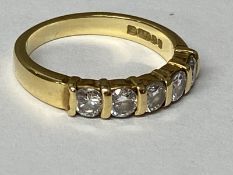 An 18ct gold five stone diamond ring size I, 3.33g