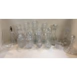 A quantity of glass decanters and stoppers, mainly modern